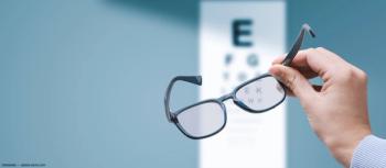 Glasses held up to VA card Image credit: ©stokkete - adobe.stock.com