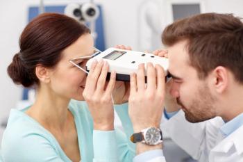 Doctor and patient using pupillometer Image credit: AdobeStock/SydaProductions