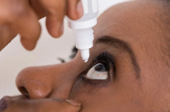 Woman uses eye drops