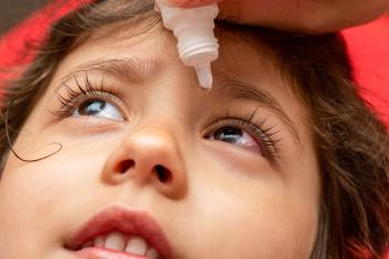 Child receiving eye drops Image credit: AdobeStock/vitalis83