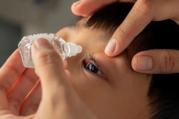Child having drops administered into eye Image credit: AdobeStock/Dipo