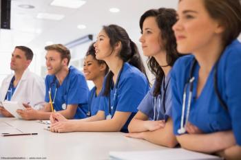 Group of medical students at table Image credit: ©WavebreakMediaMicro - adobe.stock.com