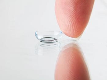 Finger next to contact lens Image credit: AdobeStock/dp3010