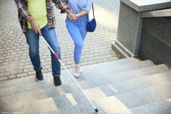 Man using white cane up stairs Image credit: AdobeStock/Pixel-Shot