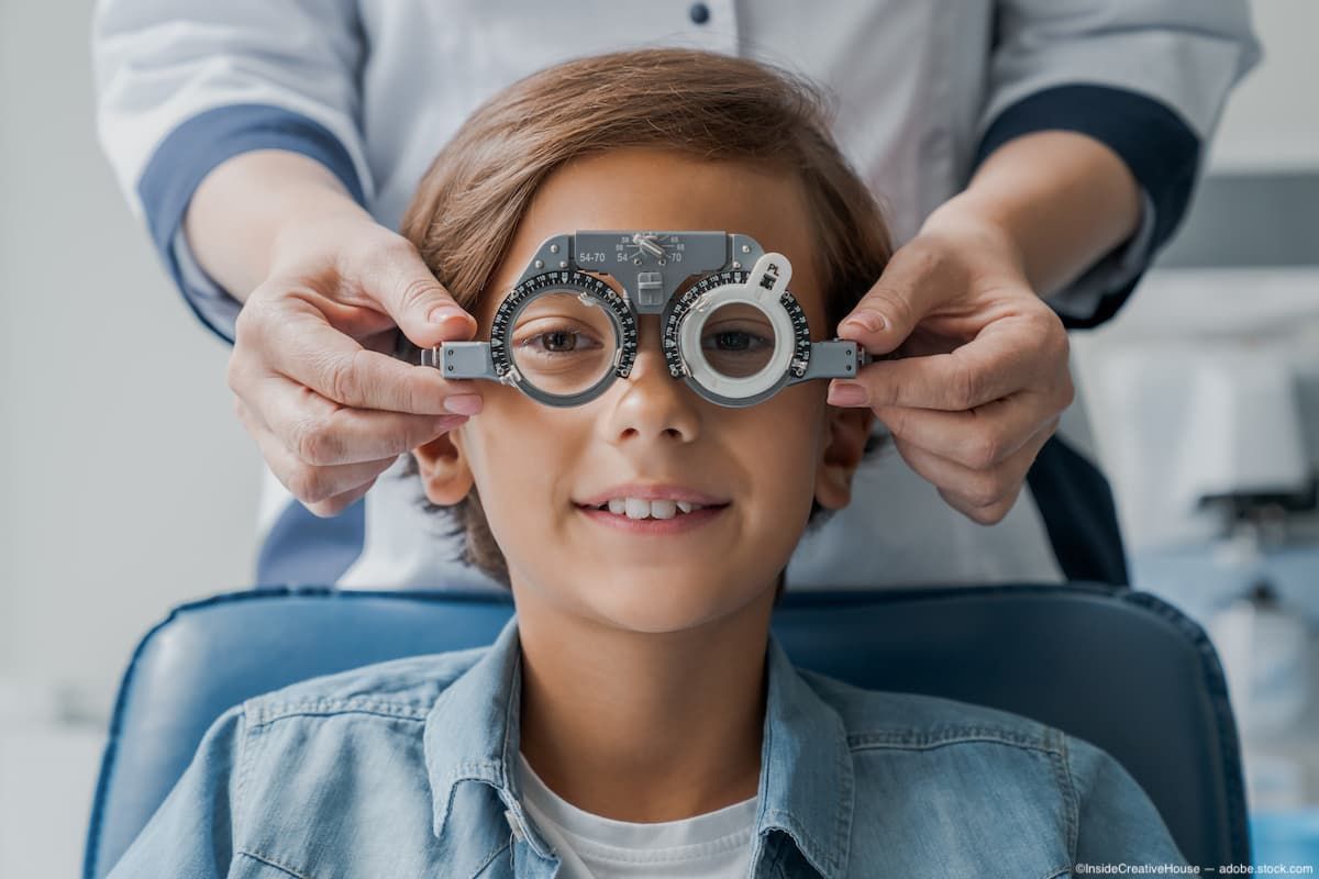 Boy sitting in pediatric office getting vision testing done by physician Image credit: ©InsideCreativeHouse - adobe.stock.com