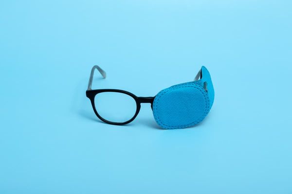 Pair of glasses with eye patch Image credit: AdobeStock/Tasha