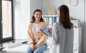 Doctor talking with patient in office Image credit: AdobeStock/SydaProductions