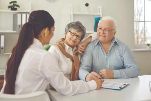 Family talking to doctor Image credit: AdobeStock/StudioRomantic