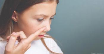 young girl inserting contact lens Image credit: ©irena_geo - adobe.stock.com