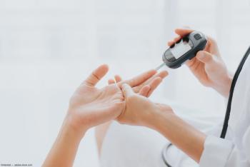 Doctor administering glucose level test Image credit: AdobeStock/interstid