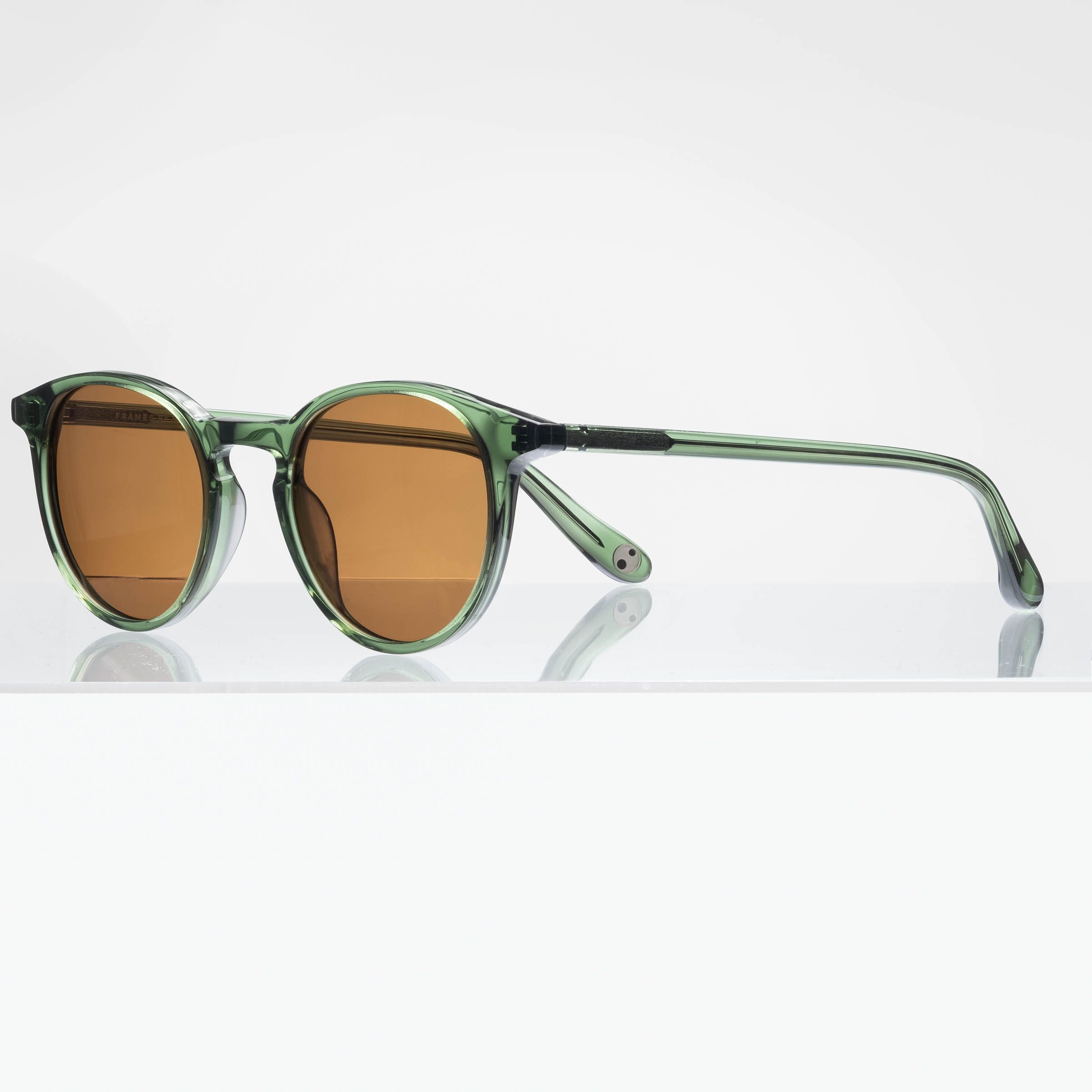 Kepler is a narrow/medium, masculine, acetate frame with polarized lenses. It is available in emerald crystal, matte eclipse and sun spot tortoise color options.