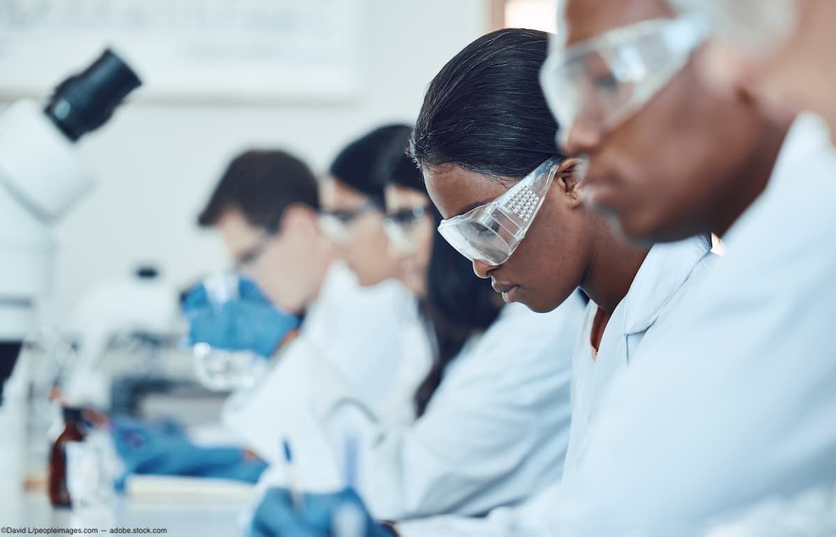 Scientists sitting in lab conducting clinical trial Image credit: AdobeStock/DavidL/peopleimages.com