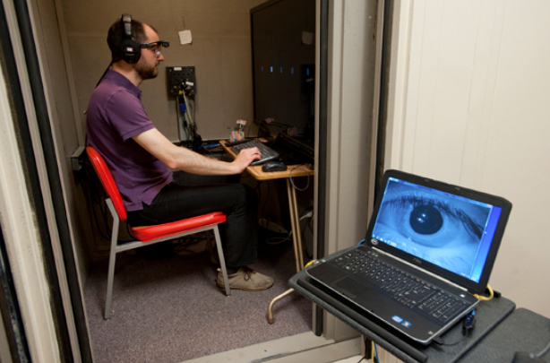 Sargent research engineer Sylvain Favrot wears the portable eye-tracker component of the visually guided hearing aid (VGHA) developed by Professor Gerald Kidd and other researchers. Photo by Cydney Scott