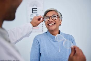 Eye doctor putting glasses on patient Image credit: AdobeStock/NadiaL/peopleimages.com