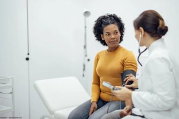 Female patient getting blood pressure taken in doctor's office Image credit: AdobeStock/bnenin 