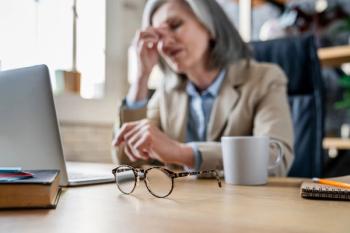 Woman at desk Image credit: AdobeStock/InsideCreativeHouse