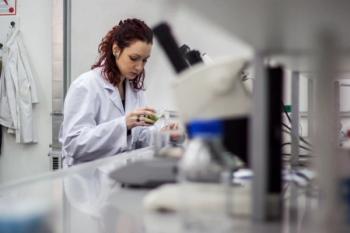 Doctoral student conducting research in lab Image credit: AdobeStock/HappyLenses