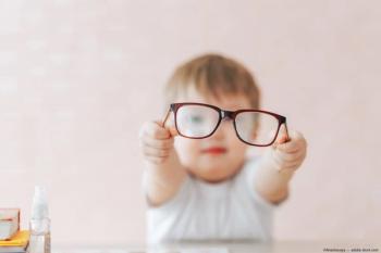 Child in background holding glasses with outstretched arms Image Credit: ©Anastassiya - adobe.stock.com