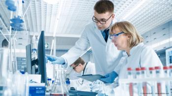 Scientists reviewing data on computer Image credit: AdobeStock/Gorodenkoff
