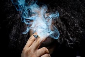 Man smoking a joint Image credit: AdobeStock/lesterman