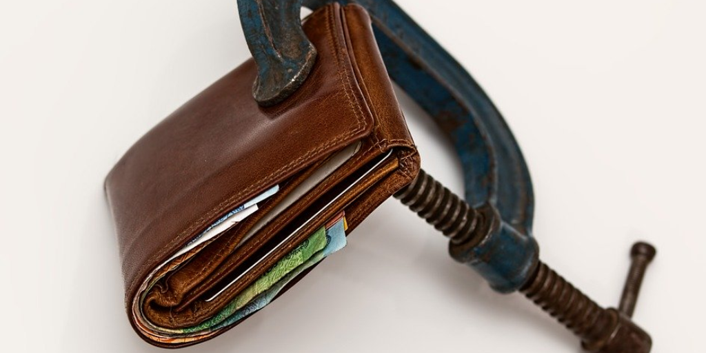 A wallet is clamped shut