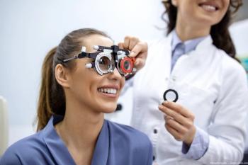Optometrist conducting visual test on patient Image credit: AdobeStock/Graphicroyalty