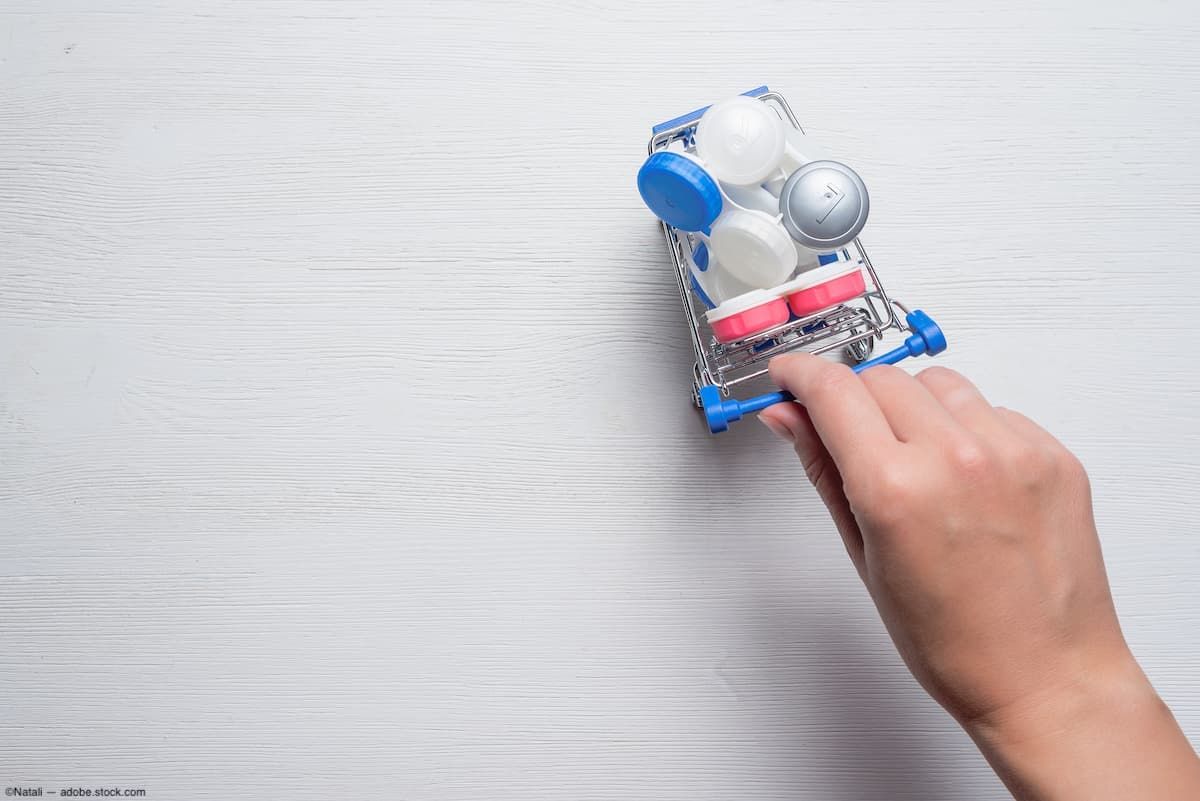 Contact lens containers in mini shopping cart getting pushed by hand Image credit: ©Natali - adobe.stock.com