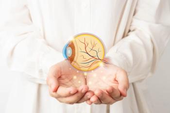 Doctor holding digital rendering of eye Image credit: AdobeStock/Orawan