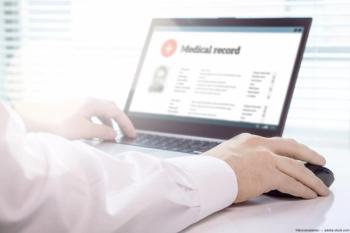 Doctor viewing EMR on laptop Image credit: ©terovesalainen - adobe.stock.com