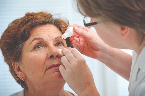 Woman receiving eye drops Image credit: AdobeStock/AlexanderRaths