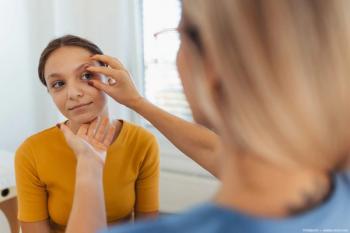 Physician conducts physical eye exam Image credit: ©Halfpoint - adobe.stock.com