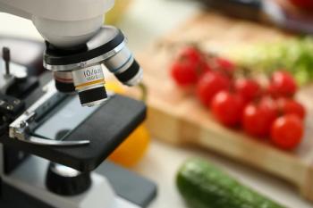 Microscope next to vegetables on table Image credit: AdobeStock/H_Ko
