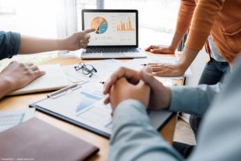 Business meeting analyzing data Image credit: AdobeStock/snowing12