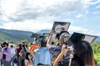 A group of people viewing the eclipse outside Image credit: ©thebigland45 - adobe.stock.com