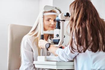 Patient getting retinal images taken by eye care provider Image credit: AdobeStock/Fxquadro