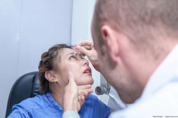 Physician administering eye drops for patient. Image credit: AdobeStock/NDSTOCK