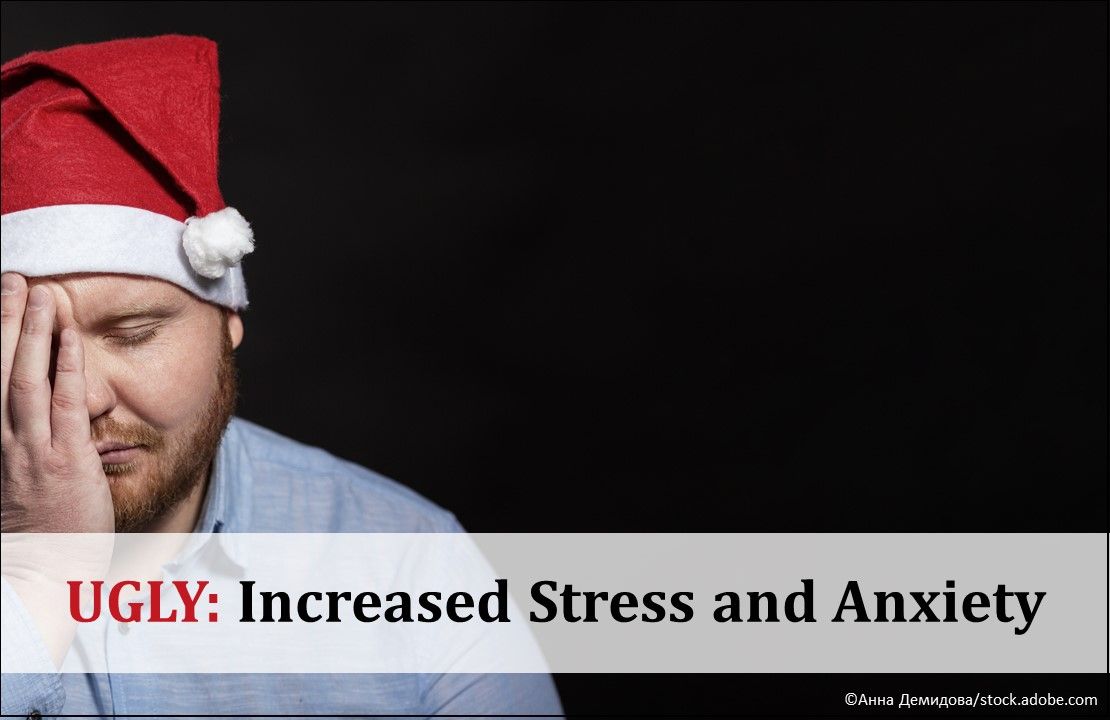 Sad man with a red beard in a Santa Claus hat covering face with hand, depressed