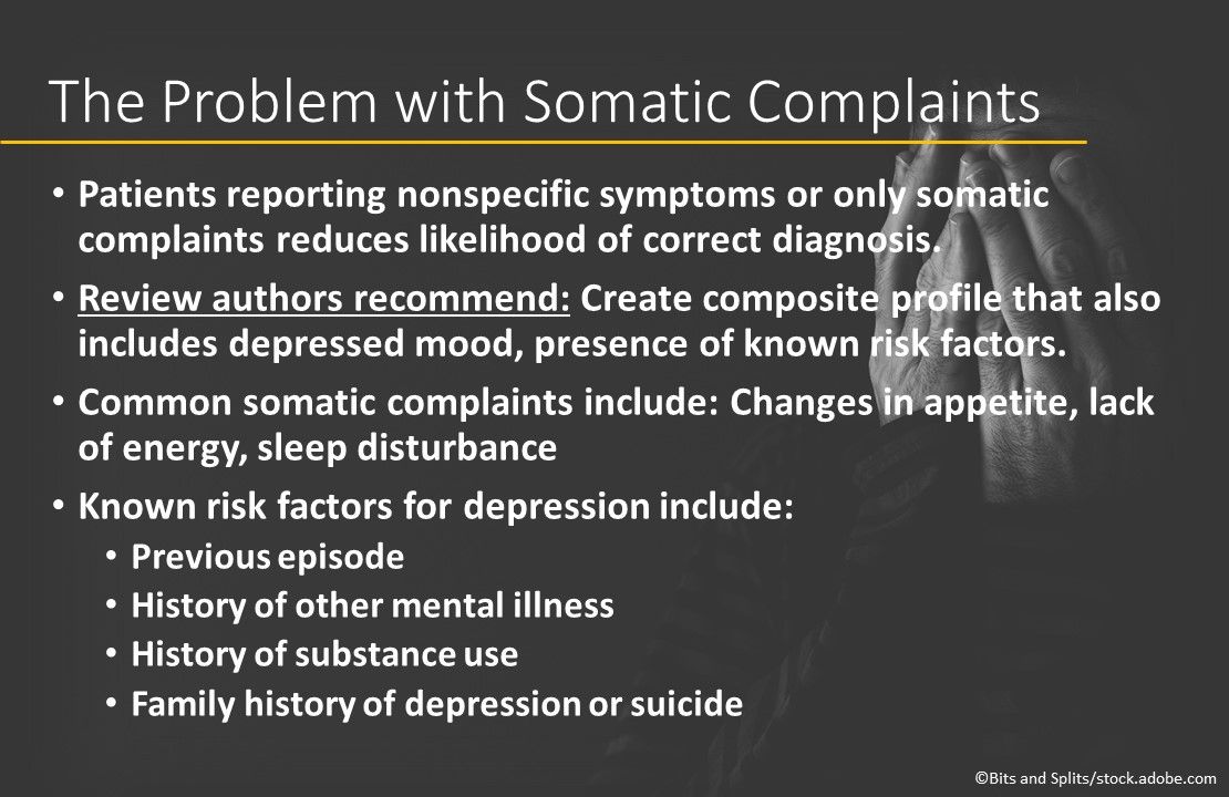 man suffering from depression holding hands over face crying