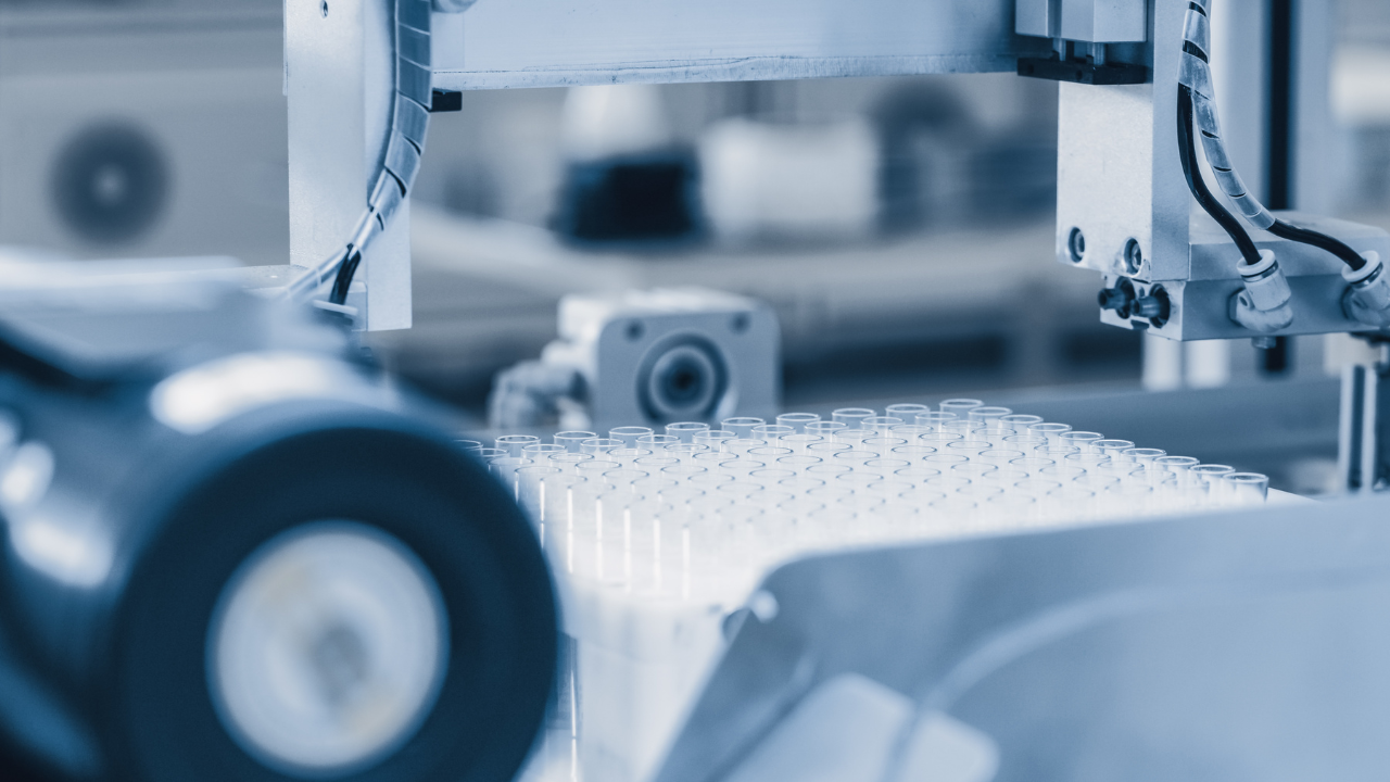 Close-up Shot of the Industrial Manufacturing Medical Test Tubes, Sorting and Packaging Process. Sterile High Precision Factory Machinery Producing Items for Medical Use. Abstract Industrial Concept. Image Credit: Adobe Stock Images/Gorodenkoff
