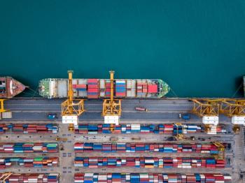 Top view of international port with Crane loading containers in import export business logistics. | © Travel man - stock.adobe.com
