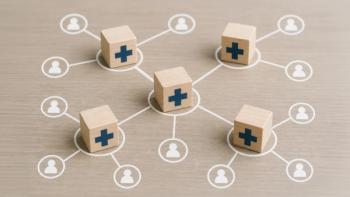 Wooden blocks with medical crosses form a network connecting to people icons, symbolizing a healthcare system, medical distribution, or health insurance network. | © TransPicHub - stock.adobe.com (2014152920)