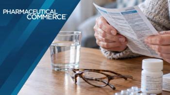 Elderly person read medicine leaflet on wooden table with water glass and pills | Sandor - stock.adobe.com