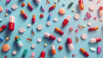 A different of colorful pills and capsules scattered on a light blue surface. Pharmaceutical industry, rising prices of drugs, drug production, shortage of drugs in pharmacies | © Natalia S. - stock.adobe.com 1055460238