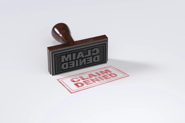 Rubber stamping that says Claim Denied on White Background | Image Credit: © Nirmal - stock.adobe.com