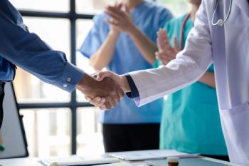 Conference room in the hospital, a group of doctors attending a handshake meeting, a meeting of executive doctors and chiefs meeting with pharmaceutical dealers. Doctor meeting concept. | © kamiphotos - stock.adobe.com