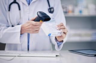 Pharmacist, hands and scanning pills, cashier with woman and pharmacy, digital scanner and stock barcode. Pharmaceutical, tablet box and female person with health, medicine and retail commerce | © sharne/peopleimages.com - stock.adobe.com