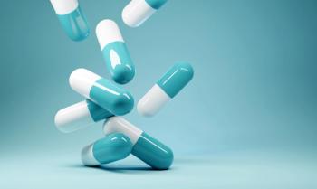 A group of antibiotic pill capsules falling. Healthcare and medical 3D illustration background. | © James Thew - stock.adobe.com