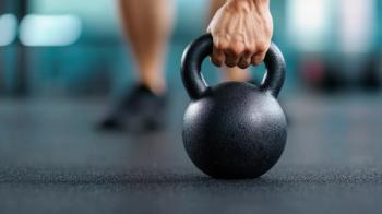 Man holding kettlebell handle | Image Credit: © WIrul - stock.adobe.com