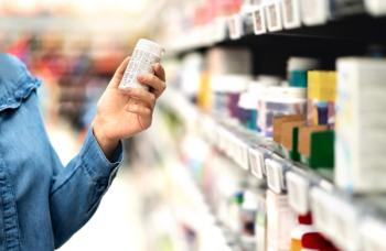 Patient holding prescription bottle