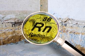 Preparatory stage for the construction of a ventilated crawl space in an old brick building - Searching gas radon concept image seen through a magnifying glass - Image credit: Francesco Scatena | stock.adobe.com